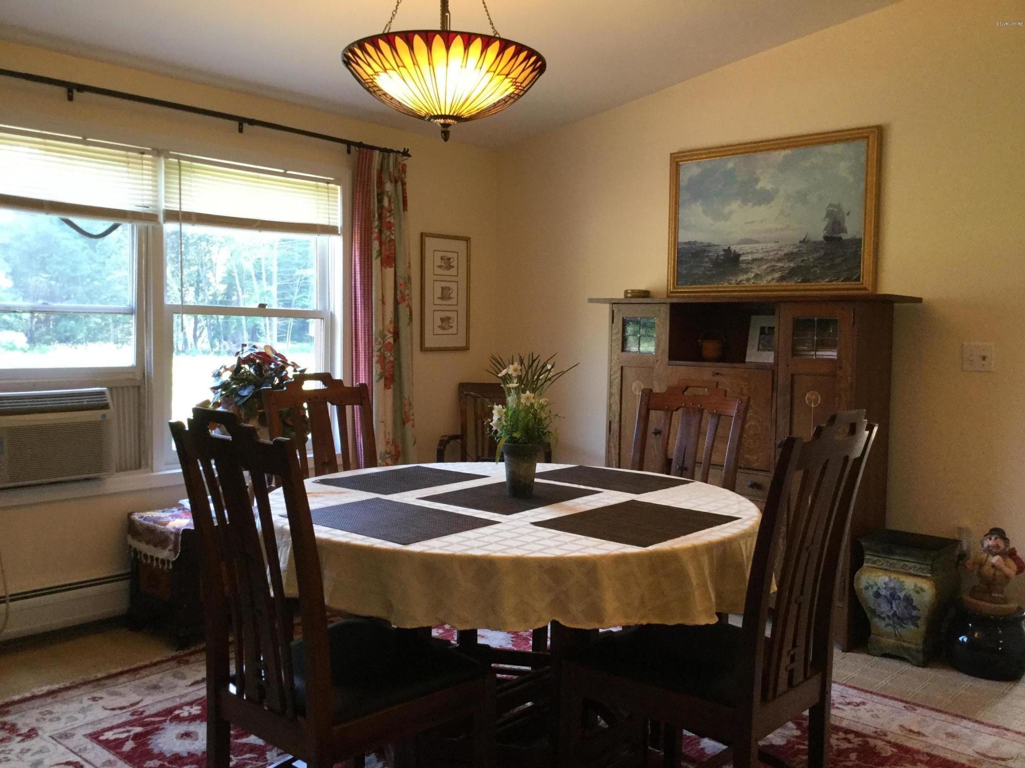 355 Salisbury Road Sheffield, MA 01257 - Photo 10 of 33 a view of a dining room with furniture and chandelier