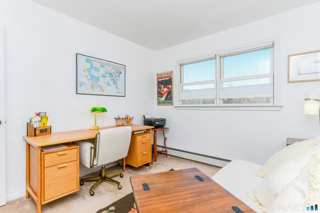 a workspace with furniture and window