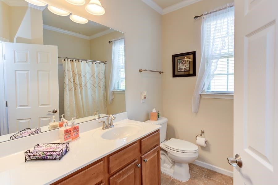 8612 Lasilla Way Raleigh, NC 27616 - Photo 17 of 27 Hall bath with a shining tub/shower is conveniently located by the secondary bedrooms. Bathroom
