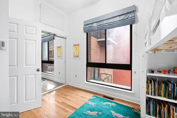 a view of an entryway with wooden floor