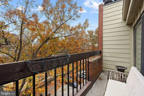 a view of balcony with furniture