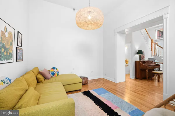 a bedroom with furniture and a wooden floor