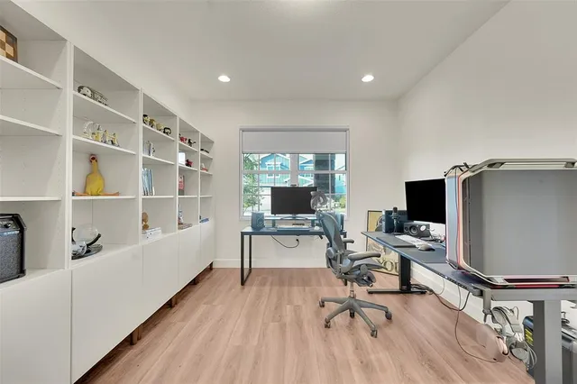 a workspace with furniture hardwood and a window