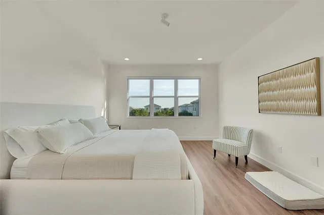 a bed room with a bed and a window