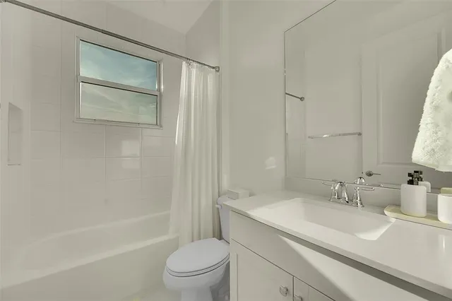 a view of a workspace with furniture and wooden floor