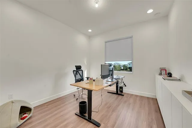 a bedroom with a bed and a night stand