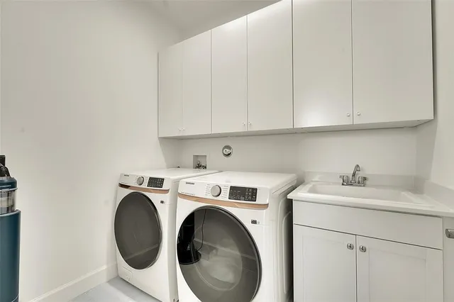 a view of a patio with table and chairs and potted plants