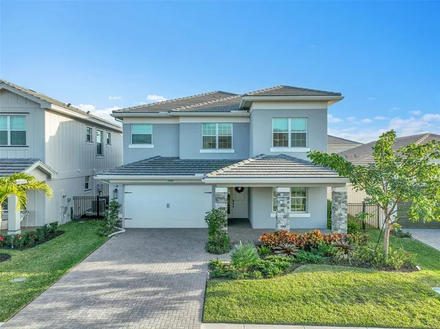 a aerial view of a house with a yard
