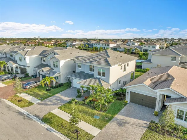 an aerial view of a house with a garden
