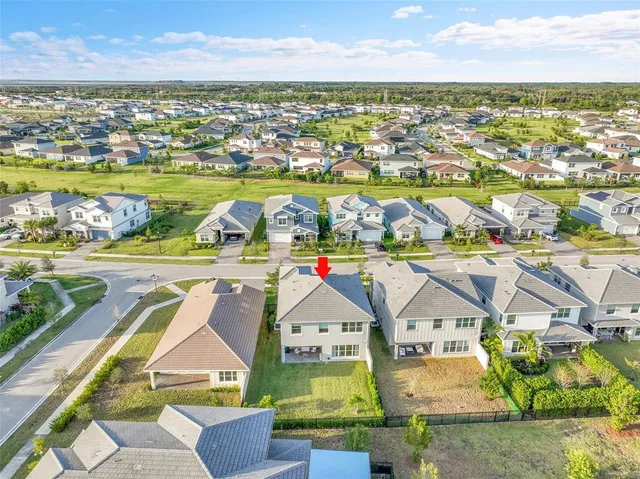 a view of a swimming pool with a yard