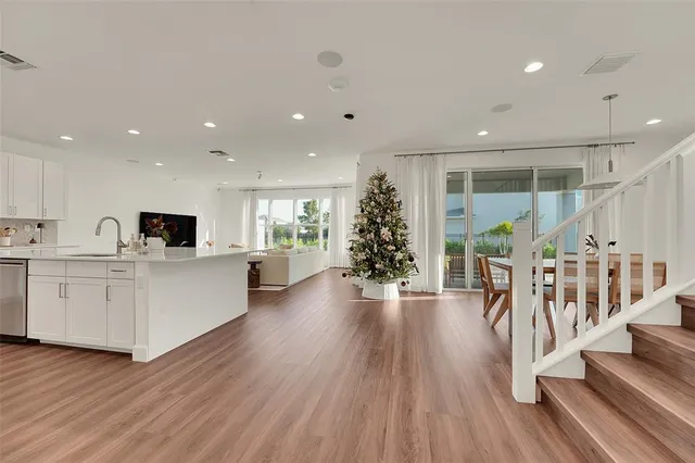 a view of kitchen with furniture and wooden floor