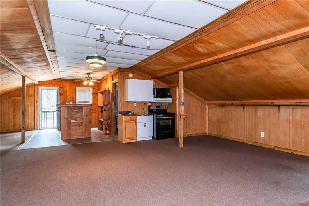 6750 Little Twin Road Germantown, OH 45327 - Photo 65 of 88 This versatile space offers wood paneling and practical kitchen features, perfect for a cozy retreat.