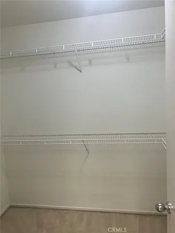 a view of a room with racks on the wall