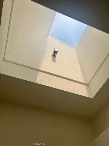 a kitchen with granite countertop cabinets stainless steel appliances and a sink