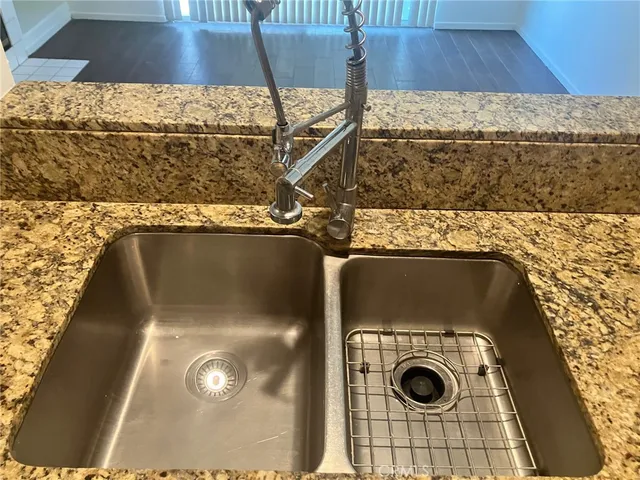 a view of a livingroom with wooden floor and a fireplace