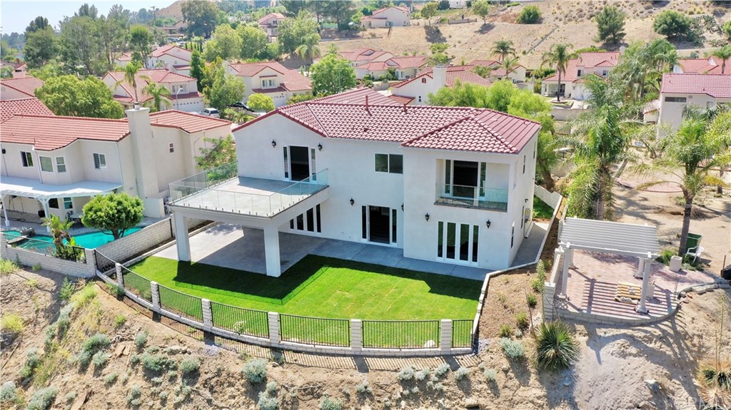 an aerial view of a house with a big yard