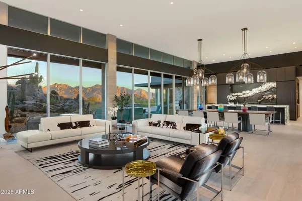 a view of a dinning tables and chairs in a patio