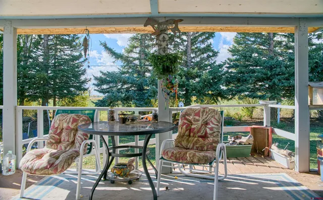 a view of roof deck with furniture