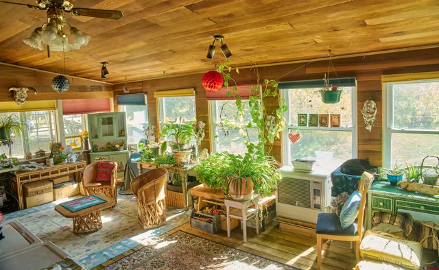 a room with lots of furniture and a chandelier