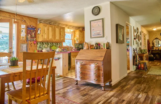 a room with chairs a washer and dryer