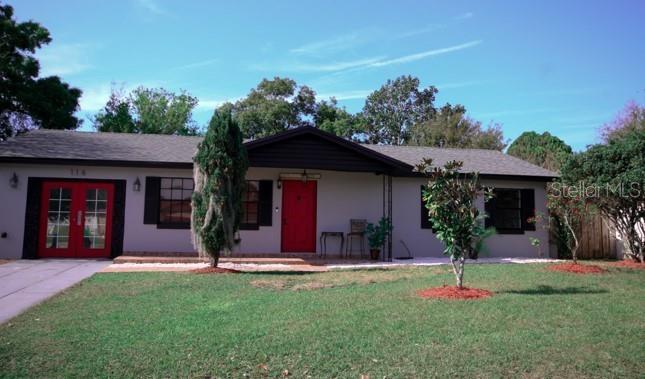 116 Cuautla Way Kissimmee, FL 34743 - Photo 1 of 1 a front view of a house with a yard