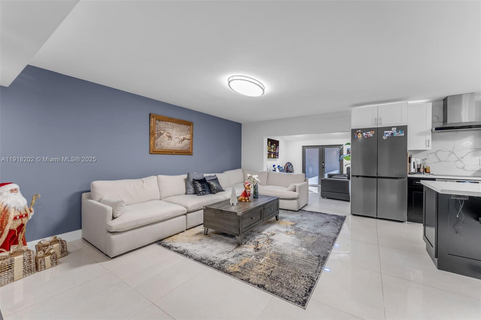 11830 Southwest 104th Lane Miami, FL 33186 - Photo 13 of 48 a living room with furniture a counter space and stainless steel appliances