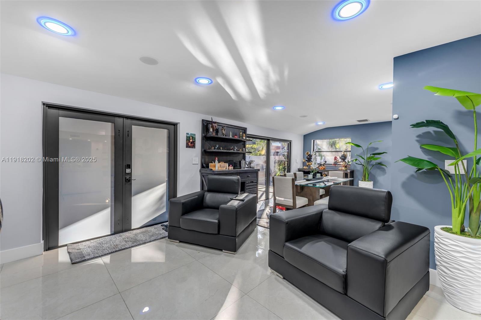 11830 Southwest 104th Lane Miami, FL 33186 - Photo 14 of 48 a living room with furniture and a potted plant