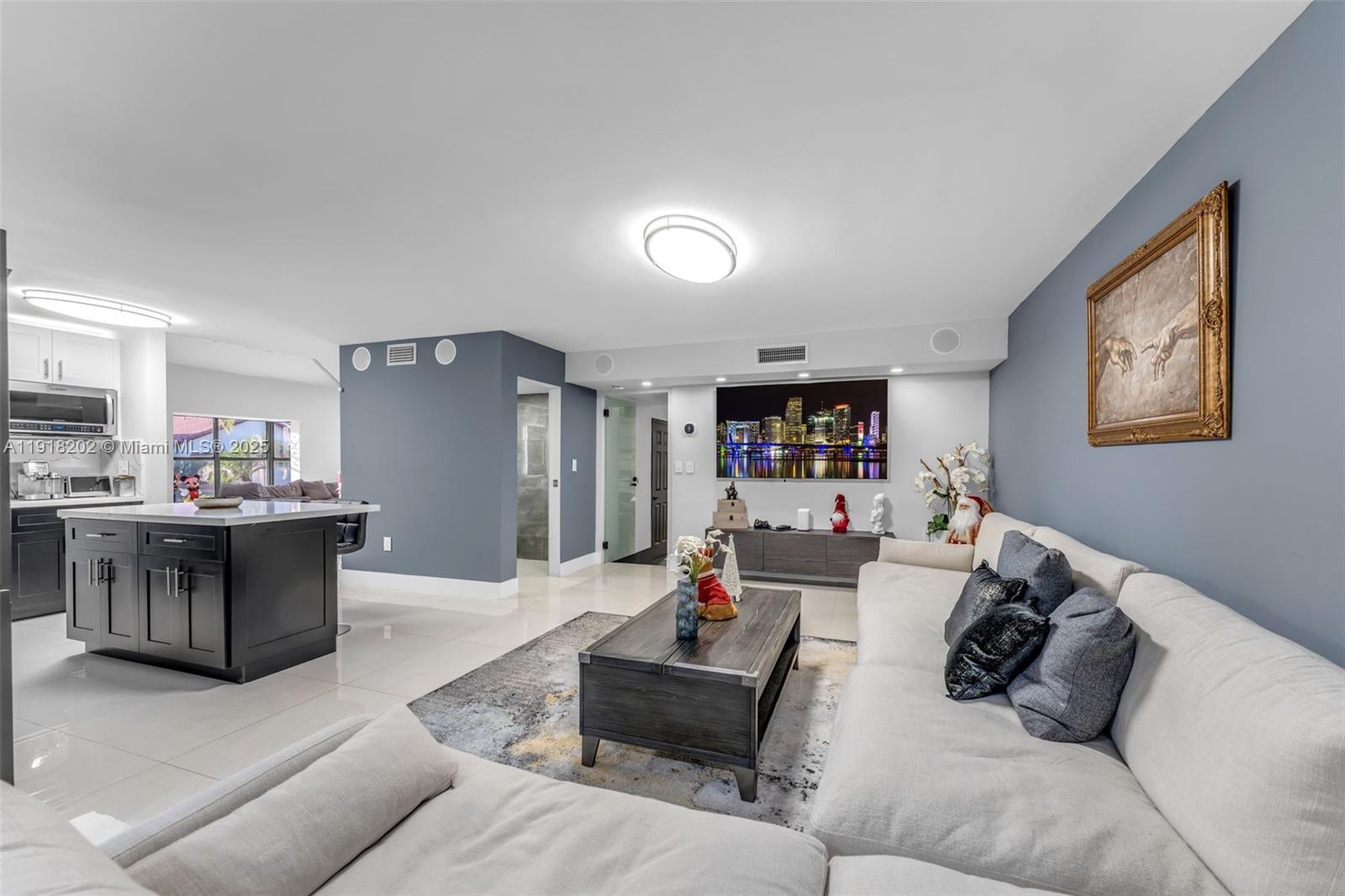 11830 Southwest 104th Lane Miami, FL 33186 - Photo 17 of 48 a living room with furniture and a wooden floor
