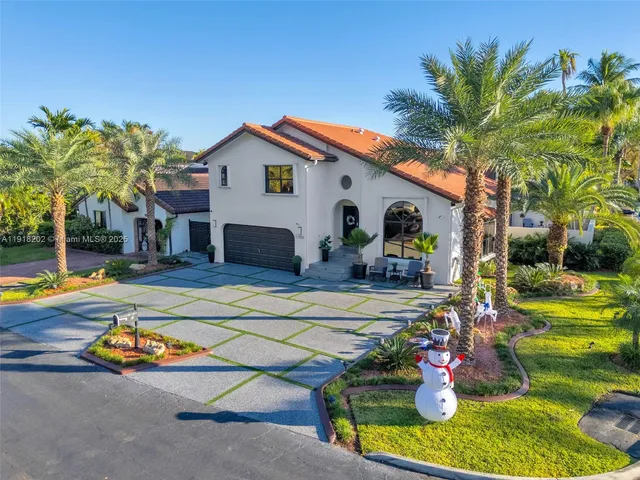 a view of a backyard with swimming pool