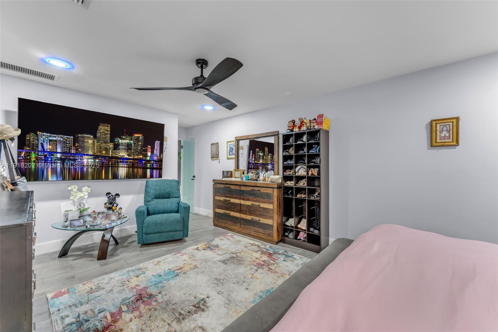 11830 Southwest 104th Lane Miami, FL 33186 - Photo 23 of 48 a bedroom with furniture and a book shelf