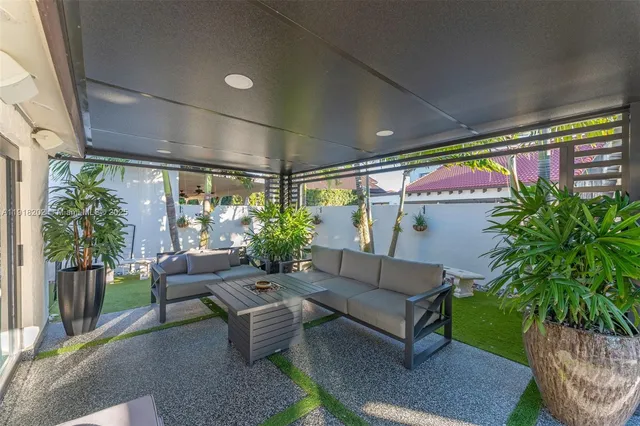 a outdoor living space with furniture and garden view