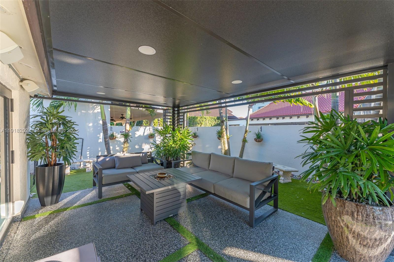 11830 Southwest 104th Lane Miami, FL 33186 - Photo 31 of 48 a outdoor living space with furniture and garden view