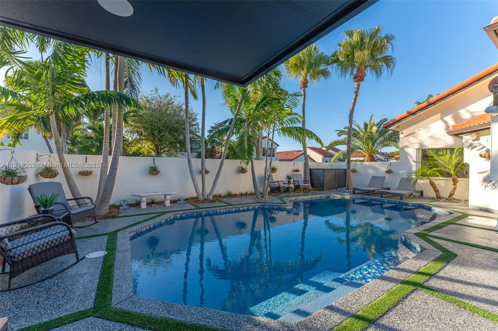 11830 Southwest 104th Lane Miami, FL 33186 - Photo 33 of 48 a living room with furniture and a large window