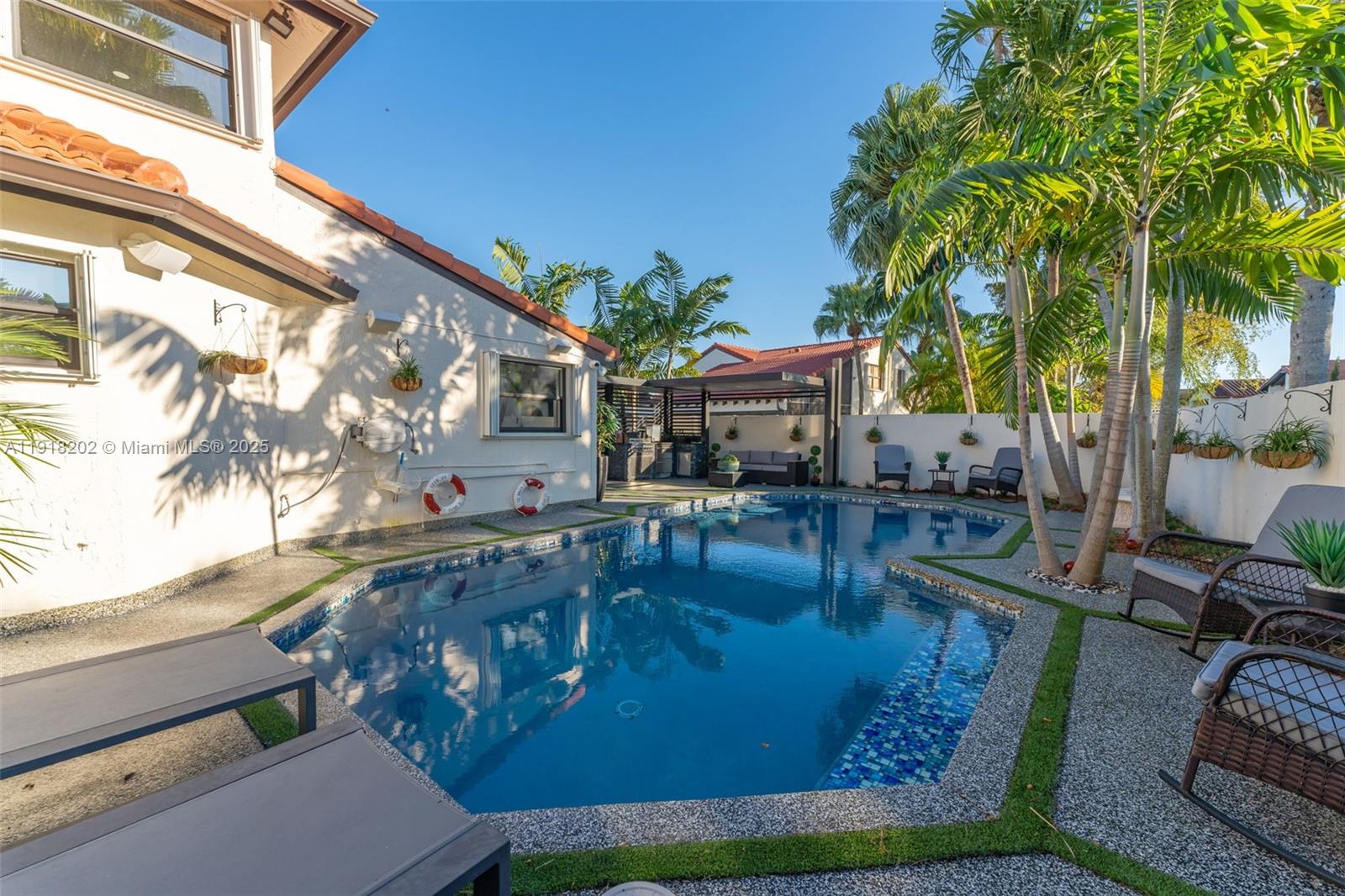 11830 Southwest 104th Lane Miami, FL 33186 - Photo 35 of 48 a view of a swimming pool with chairs