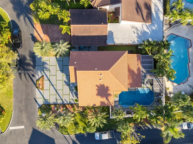 an aerial view of residential houses with outdoor space