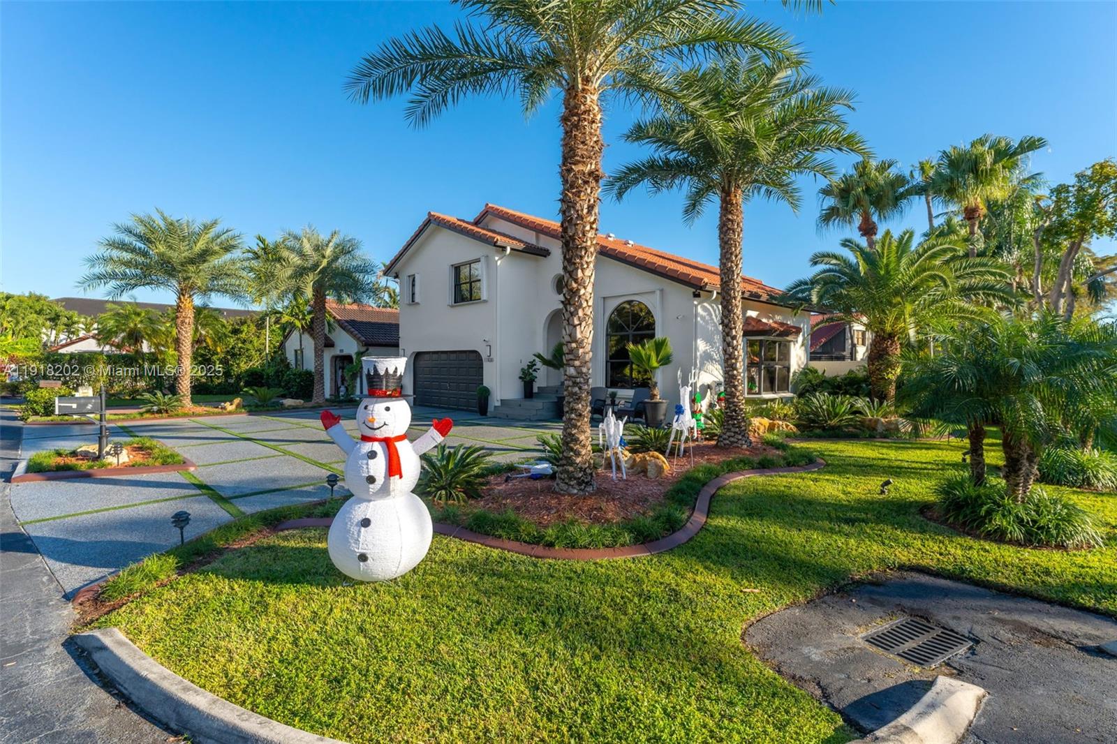 11830 Southwest 104th Lane Miami, FL 33186 - Photo 4 of 48 a front view of a house with garden and trees
