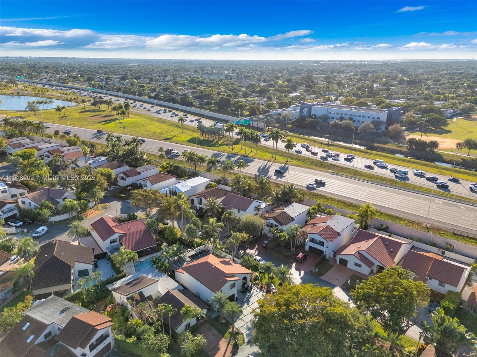 11830 Southwest 104th Lane Miami, FL 33186 - Photo 46 of 48 an aerial view of residential houses with outdoor space