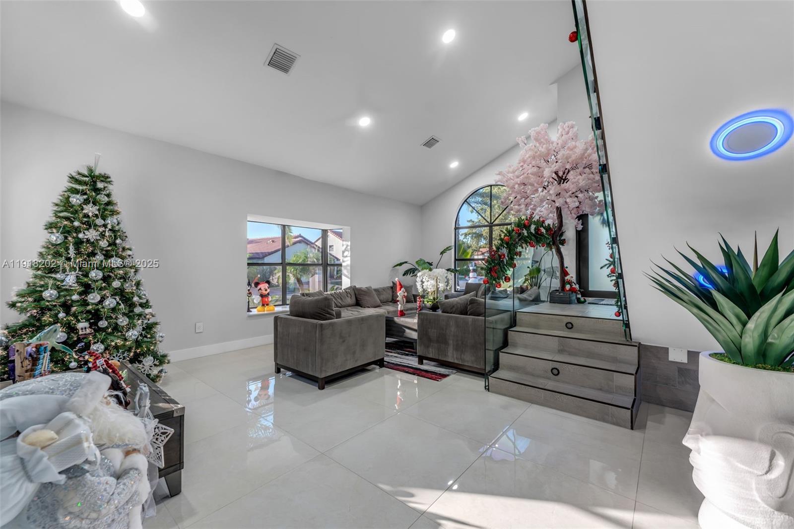 11830 Southwest 104th Lane Miami, FL 33186 - Photo 6 of 48 a living room with furniture and a christmas tree