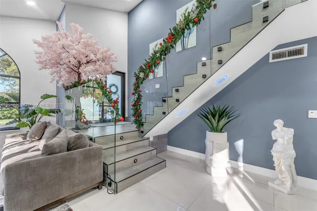 a living room with furniture flowers and flowers
