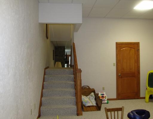 1299 Arona Road Irwin, PA 15642 - Photo 12 of 18 Family Room. Lower level Gameroom area. 10 ft. ceils. The game room is actually parted by stairs from main level into two seperate sections. This area is to the right.