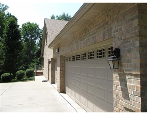 1299 Arona Road Irwin, PA 15642 - Photo 17 of 18 Other. Actually a side view of 3 car garage, concrete drive, quoin sides, man door by garage leads to stairs and hall of a 2nd entry by kitchen and laundry.