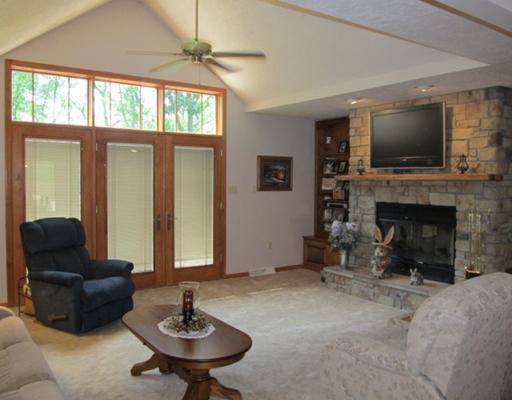 1299 Arona Road Irwin, PA 15642 - Photo 5 of 18 Den/Family/Great Room. Great Room (back of home) w/Cathedral Ceilings, Stone FP, neutral w/w carpet, recess lights, French doors to back deck, Built in bookcases. Open to Dining room area.