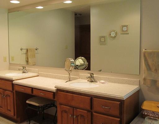 1299 Arona Road Irwin, PA 15642 - Photo 9 of 18 Master Bath/Spa. The hall from MBR has huge his/her walk-in closets that lead to Master Bath with all the extras. Double vanity, sitting/makeup area, Jac.Tub, standup shower, big linen closet w/solid wood doors, recess lights. All hard surface countertops and C.Tile.