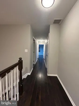 a view of gallery with wooden floor