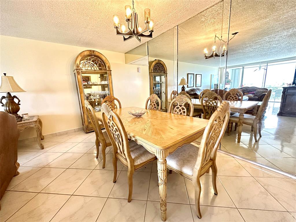 2671 South Course Drive, Unit 802 Pompano Beach, FL 33069 - Photo 3 of 34 a view of a dining room with furniture