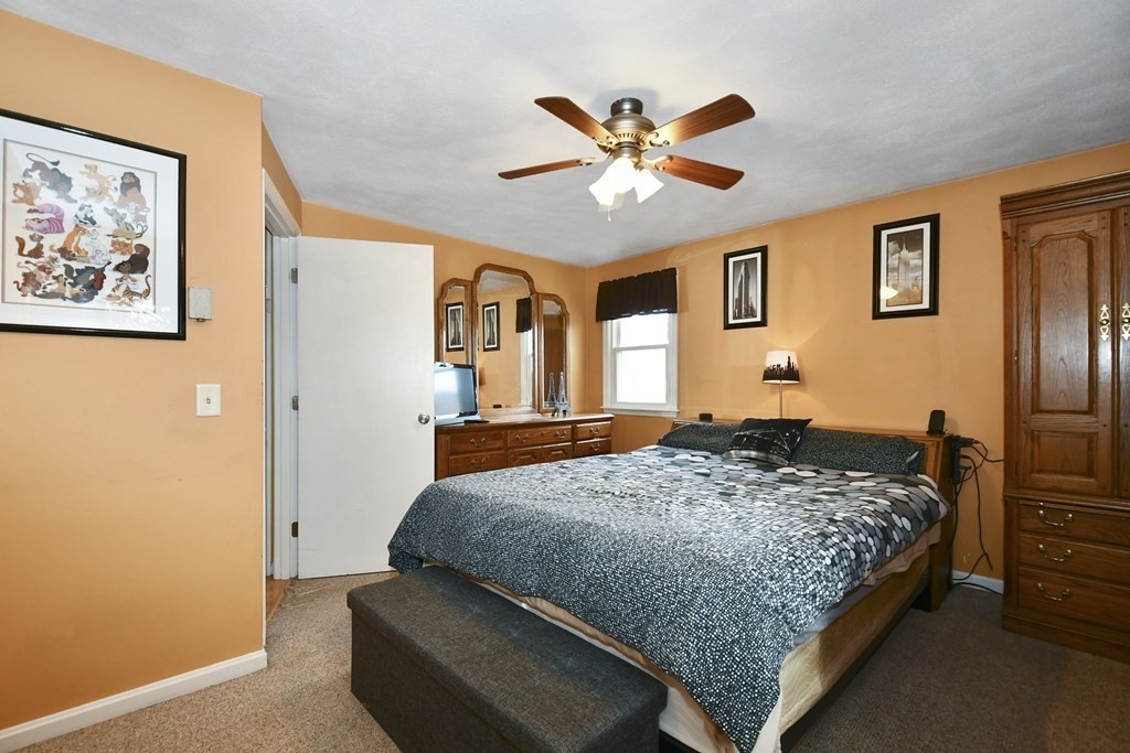 14 Oak Ridge Way Shrewsbury, MA 01545 - Photo 12 of 30 a bedroom with a bed and dresser with chair