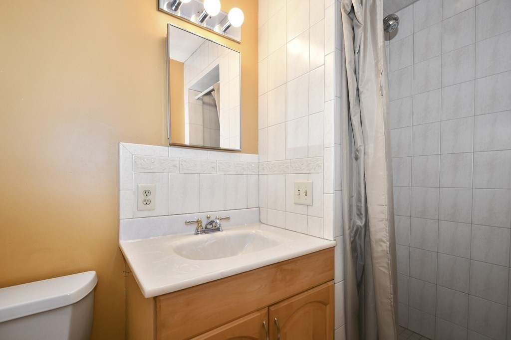 14 Oak Ridge Way Shrewsbury, MA 01545 - Photo 14 of 30 a bathroom with a sink and a toilet