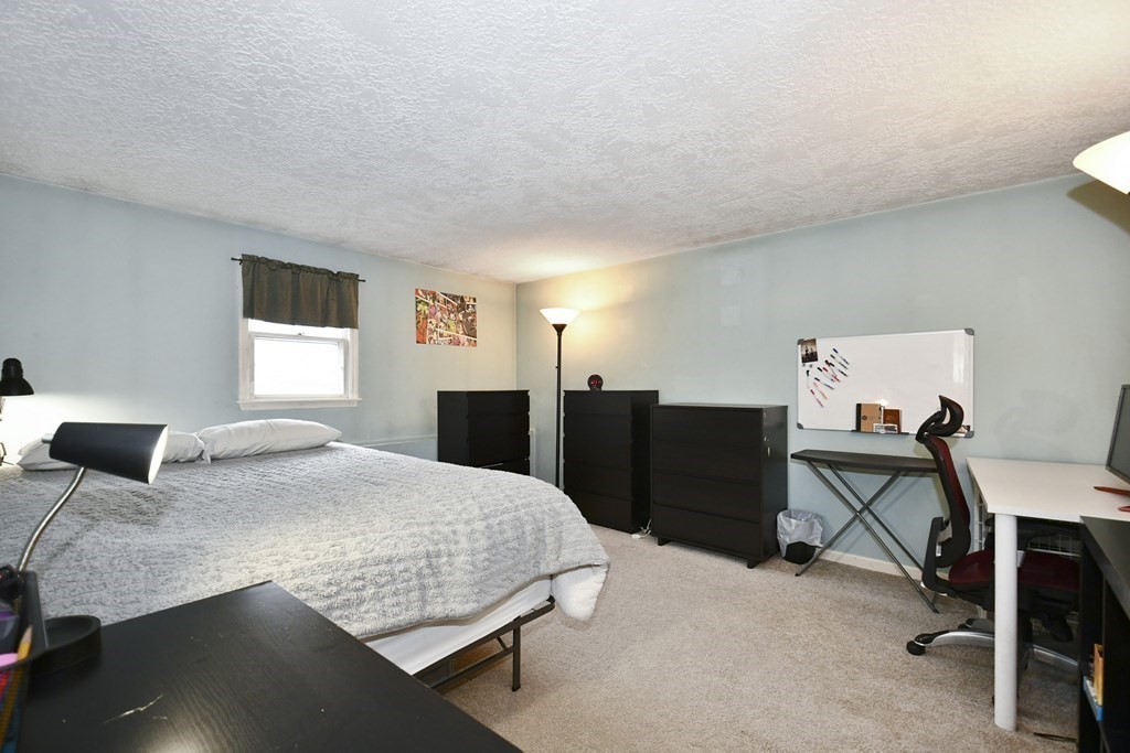 14 Oak Ridge Way Shrewsbury, MA 01545 - Photo 15 of 30 a bedroom with a bed and a desk