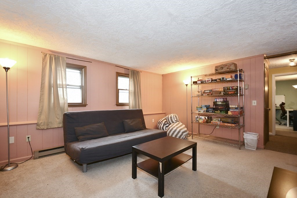 14 Oak Ridge Way Shrewsbury, MA 01545 - Photo 22 of 30 a living room with furniture and a window