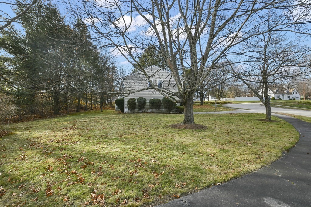 14 Oak Ridge Way Shrewsbury, MA 01545 - Photo 24 of 30 a front view of a house with a yard